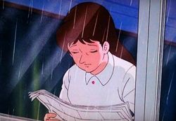寝巻？で新聞を読む明子