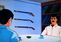 壁にむきだしの猟銃という物騒な書斎