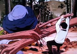 岩をどけようと懸命になる飛雄馬